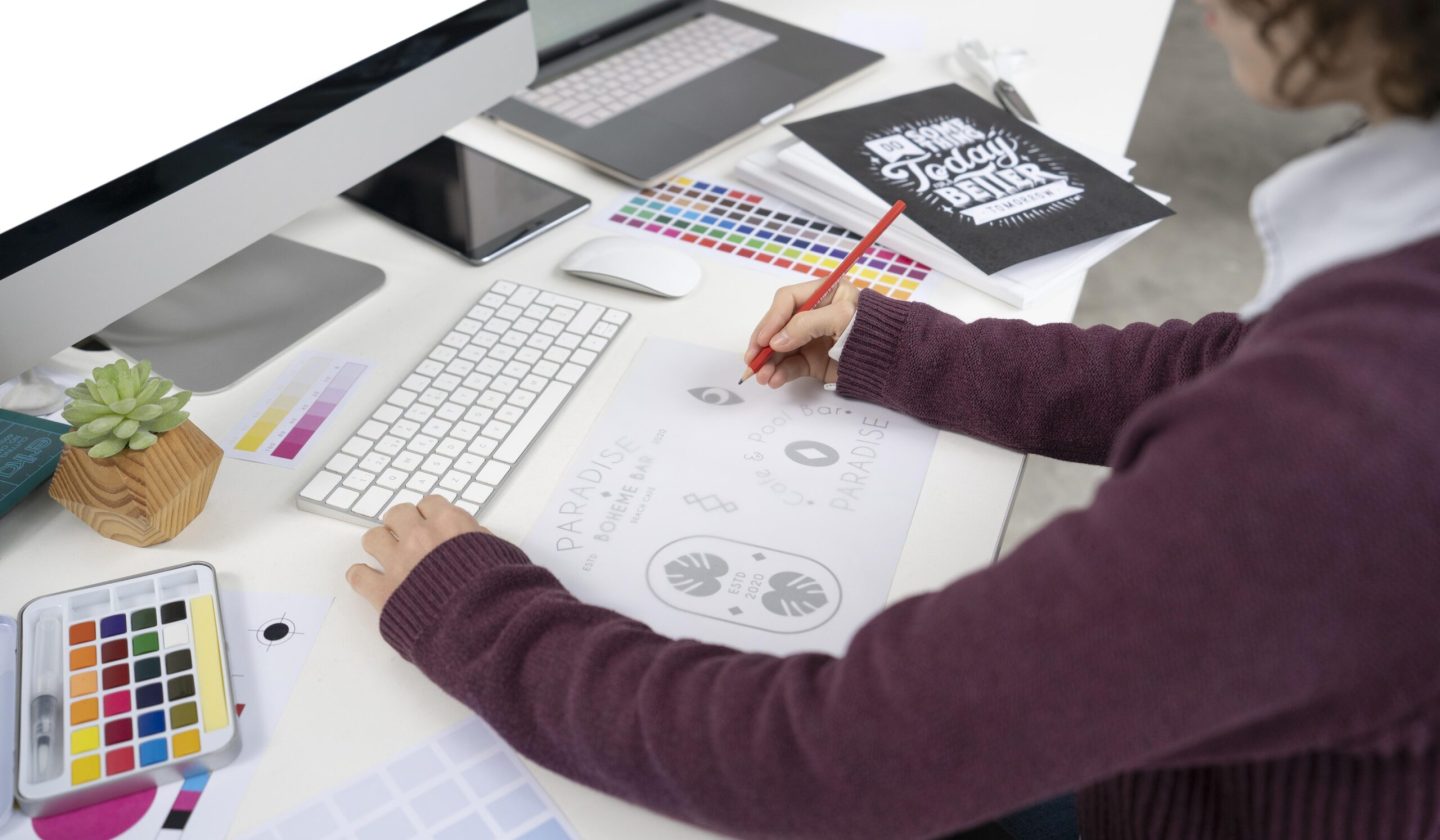 graphic-designer-making-logo-notebook graphic-designer-making-logo-notebook